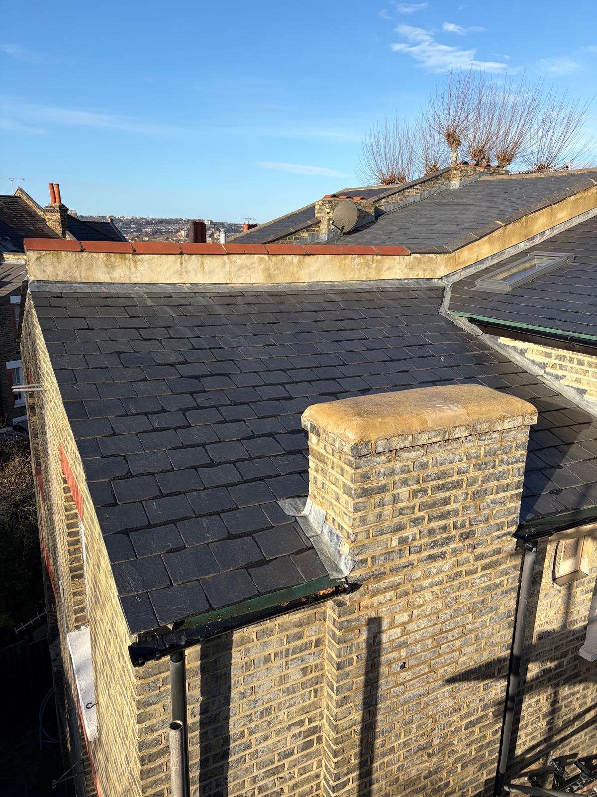 New slate roof with chimney stack viewed from above
